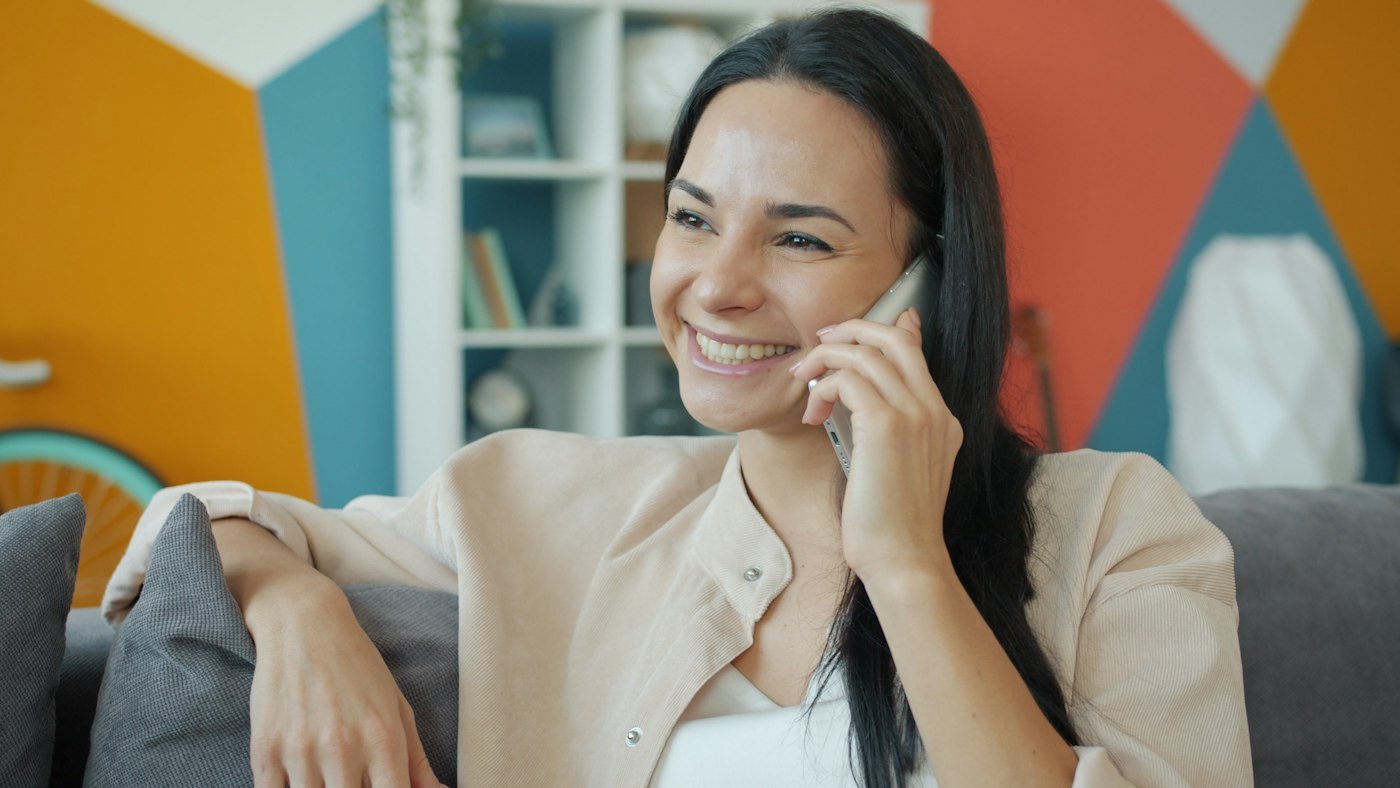 Homeowner calling a local service business from her phone