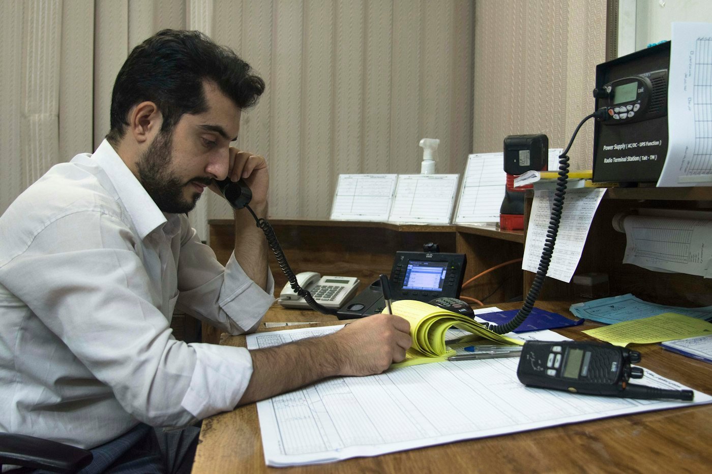 Business owner on the phone at his desk